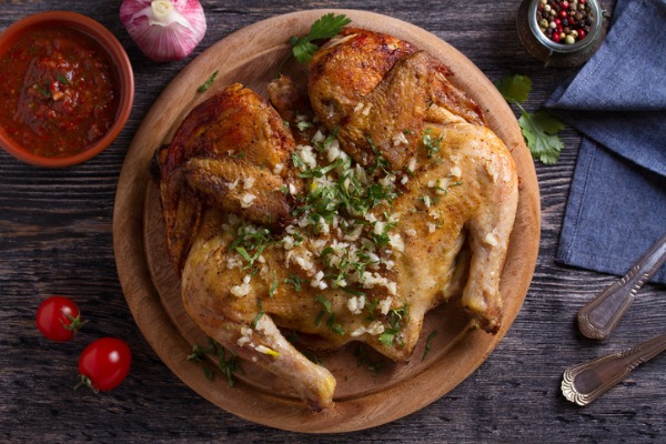 roasted-spatchcock-chicken-with-garlic-picture-id1143210658